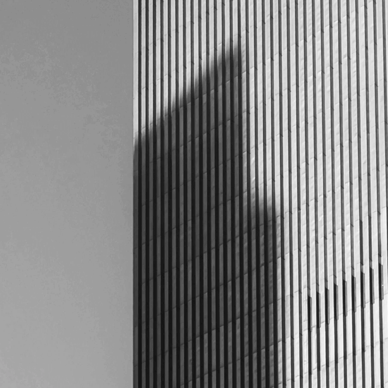 CloudMasonry Salesforce Consulting - Background Image - Shadow on modern skyscraper facade