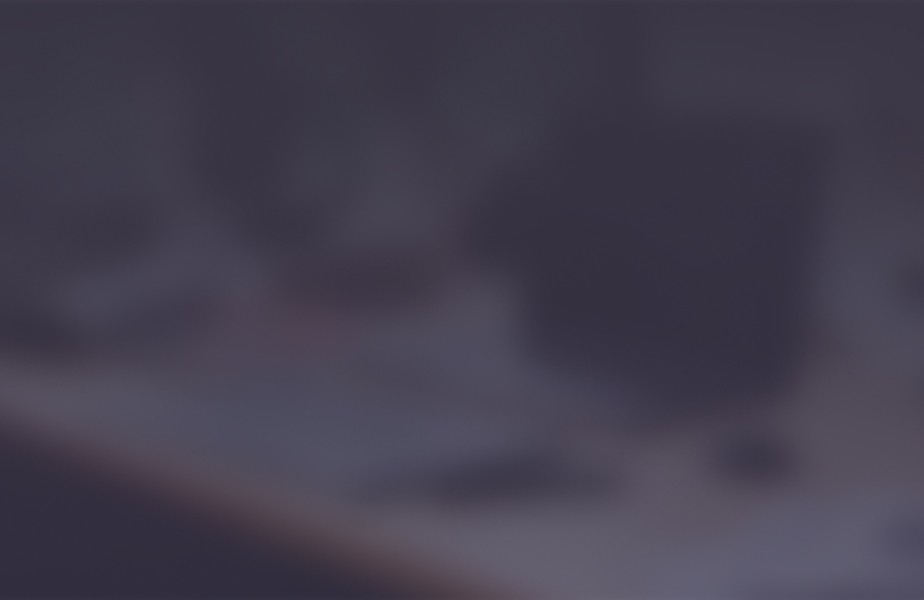 CloudMasonry Salesforce Consulting - Background Image - Blurry office desk scene.
