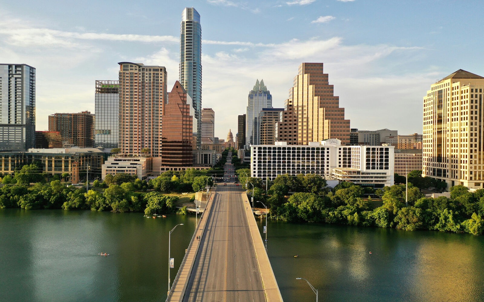 bg-austin2 CloudMasonry - Texas Based Salesforce Consulting - Austin Office Landing Page Image - Austin skyline with Congress Avenue Bridge view